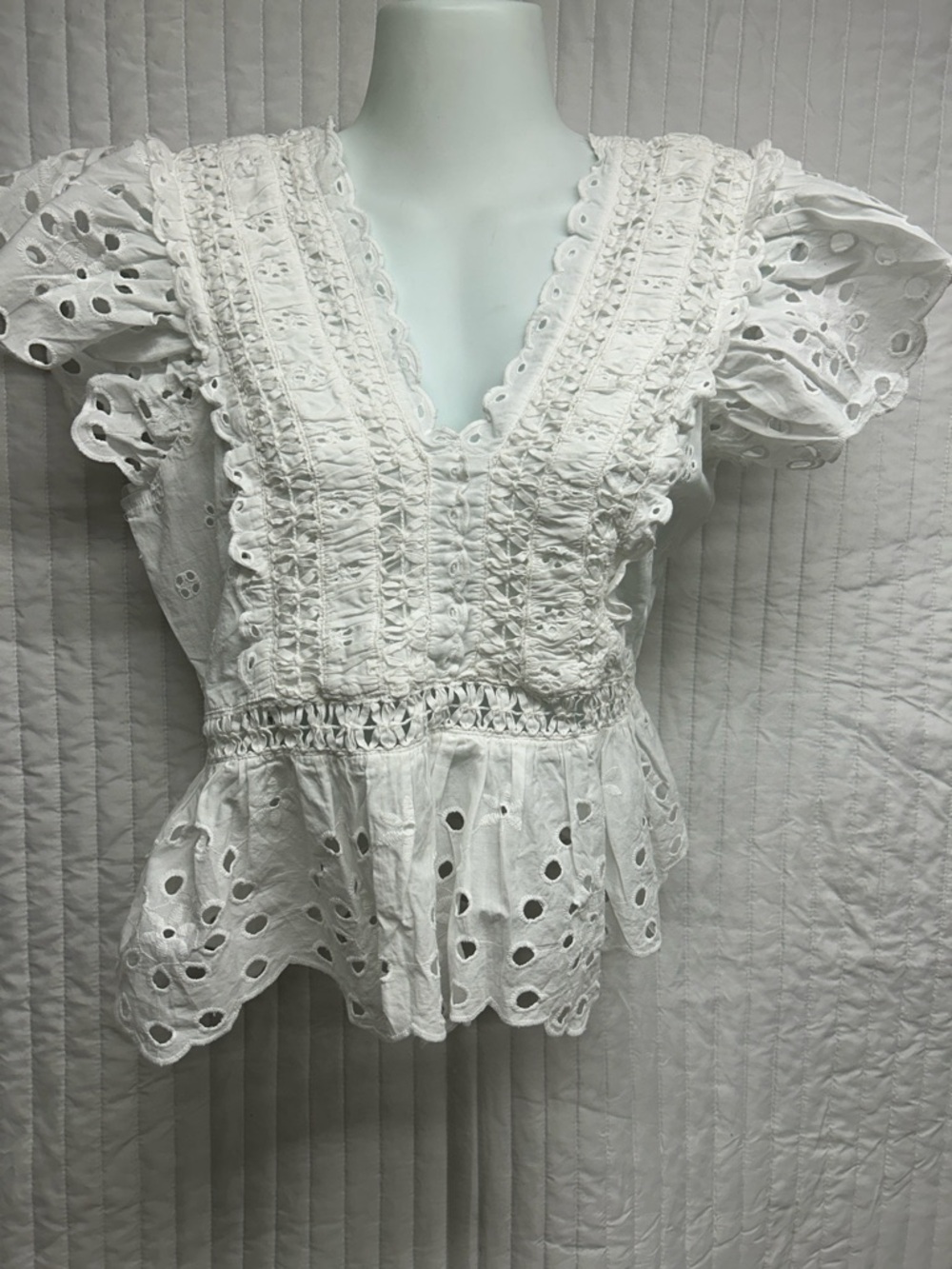 White Eyelet Peplum Blouse with V-Neck and Ruching